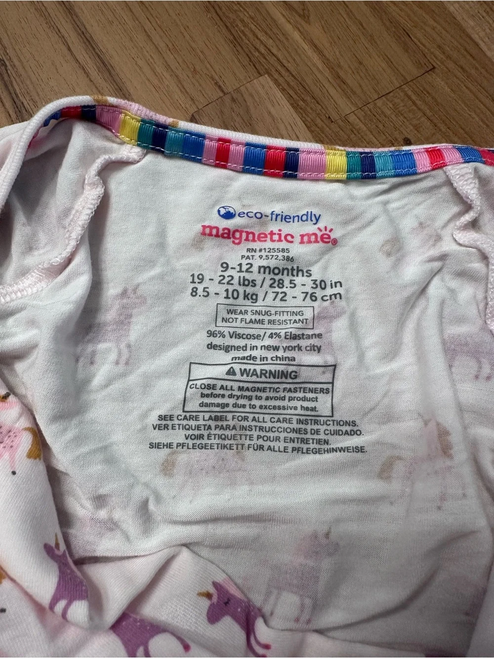 Magnetic Me White Unicorn Print Footed Pajamas with Pink & Purple Accents